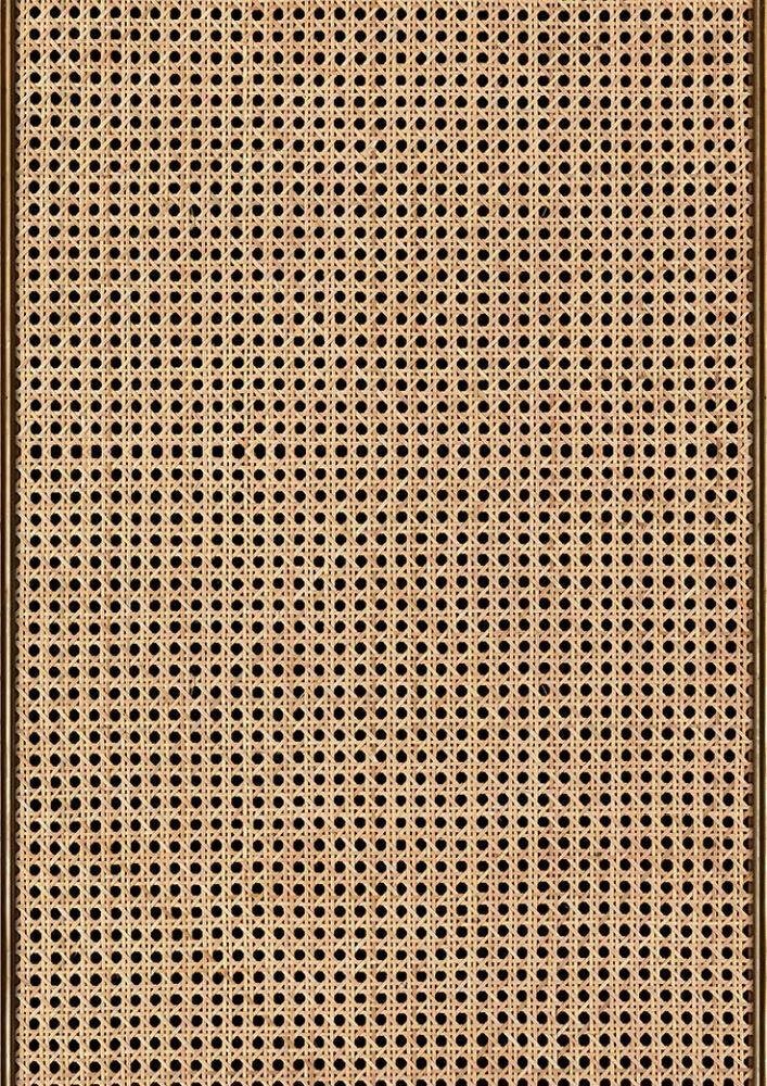 Close view of open-weave natural rattan cane.